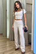 Conjunto DF14142 con cierre frontal de blusa y pantalón silueta ajustada para mujer, elaborado en rib dyaboo color beige 